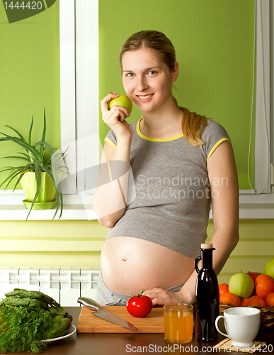Image of pregnant woman on kitchen