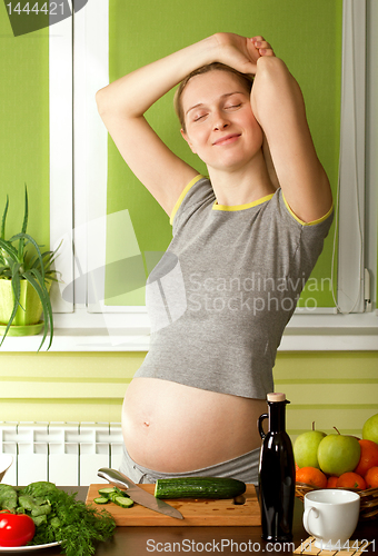 Image of pregnant woman on kitchen