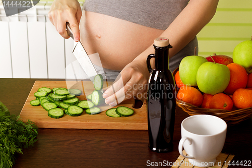 Image of pregnant woman on kitchen