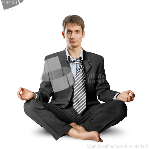 Image of businessman in lotus pose