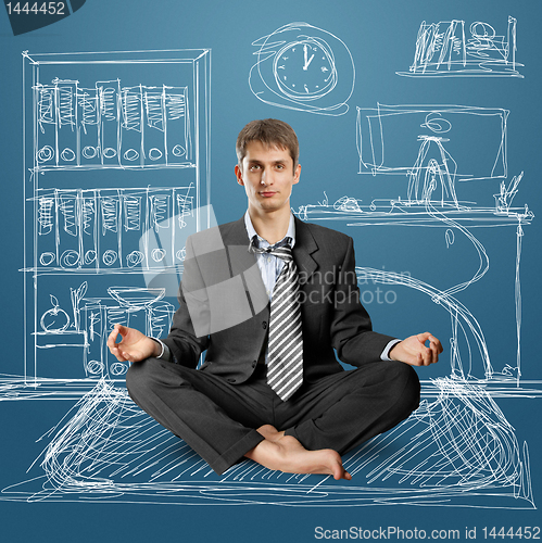 Image of businessman in lotus pose