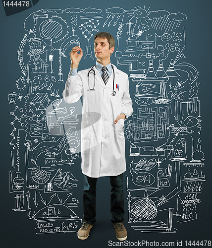 Image of Doctor male writing something 