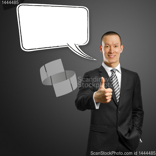 Image of asian male in suit with crossed hands and thought bubble