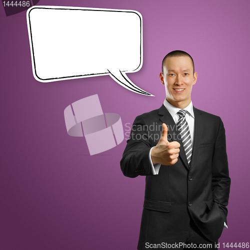 Image of asian male in suit with crossed hands and thought bubble