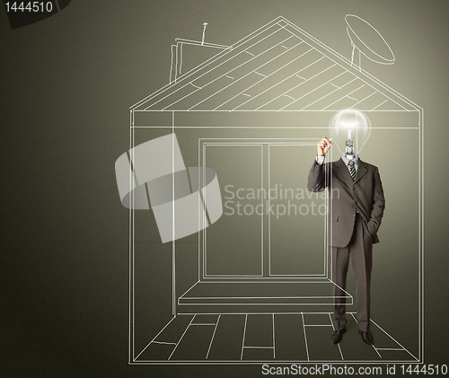 Image of businessman with lamp-head and marker in house