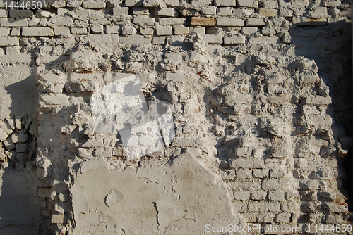 Image of Jagged white painted brick wall