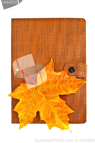 Image of Notebook closed with a maple leaf