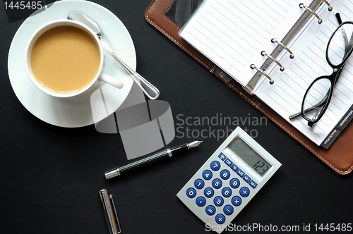 Image of coffee pen phone and paper