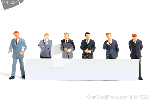 Image of business people with banner