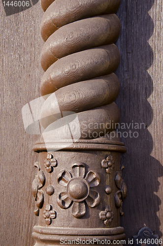 Image of Carved brown home column. Architectural detail.