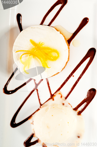 Image of  lemon mousse served whith lemon peel on top