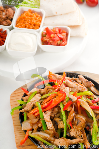 Image of original fajita sizzling hot  on iron plate