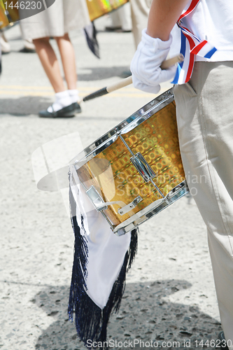 Image of Drummer playing snare drums in parade, copy space, vertical 