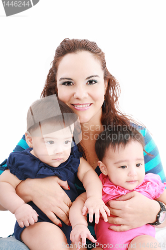 Image of Happy young mother with two babies on a white background.