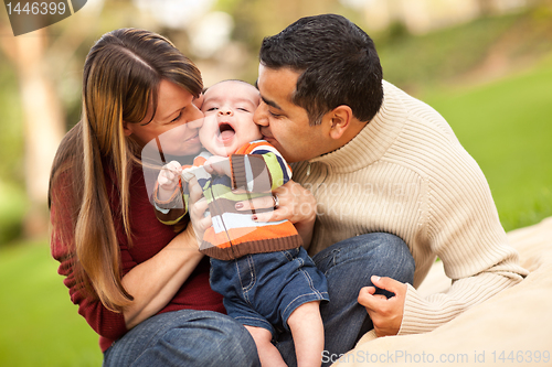 Image of Happy Mixed Race Parents Playing with Their Son