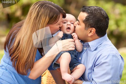 Image of Happy Mixed Race Parents Playing with Their Son