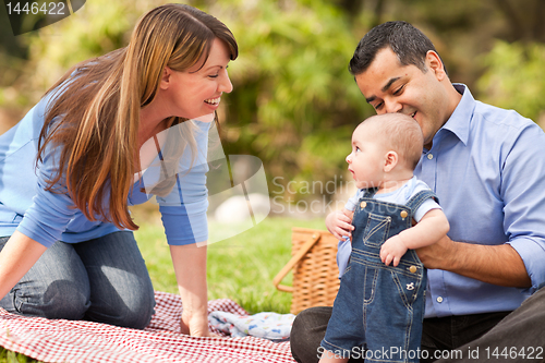 Image of Happy Mixed Race Family Playing In The Park