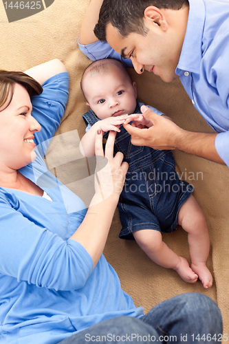 Image of Mixed Race Family Playing on the Blanket