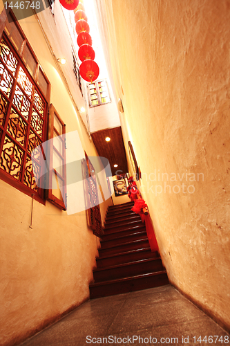 Image of Chinese traditional corridor in wooden with red lantern.