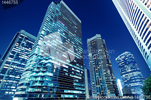 Image of Tall office buildings by night 