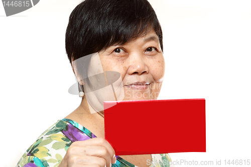 Image of Asian woman holding a red card