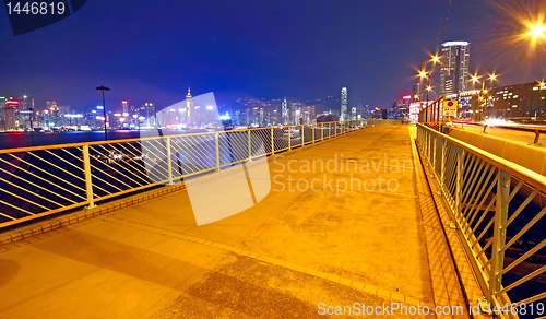 Image of pedestrian overpass and traffic bridge at night