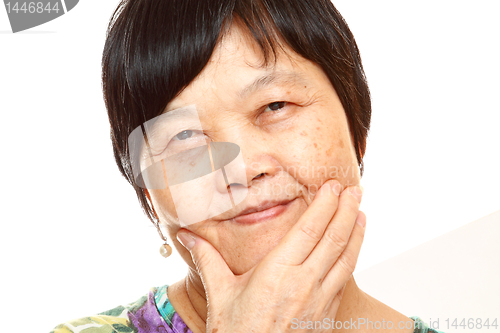 Image of Senior Asian with hand