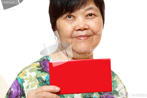 Image of Asian woman holding a red card