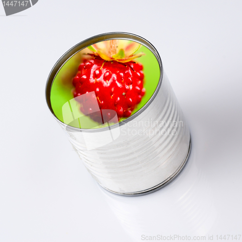 Image of wild strawberry into a  can