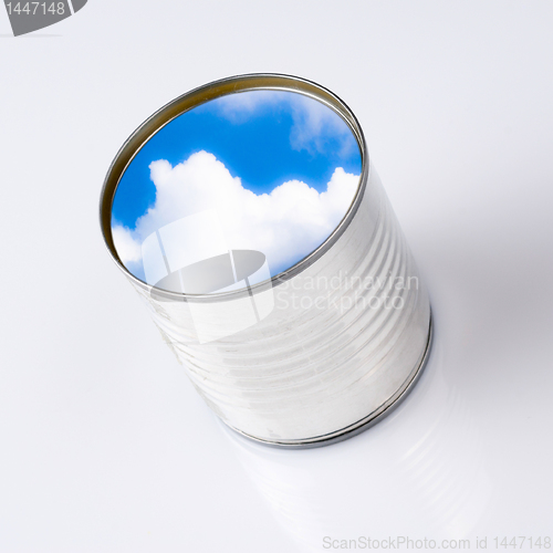 Image of blue sky into a  can