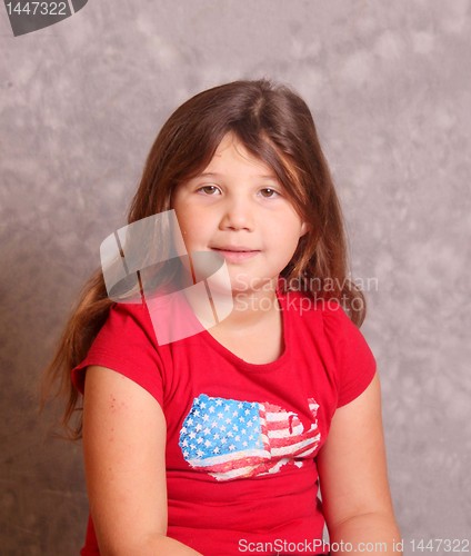 Image of Portrait of little girl in red shirt