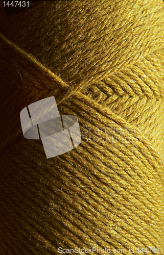 Image of Skein of gold wool knitting yarn