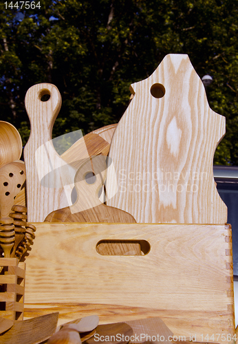 Image of Wooden cutting boards and tools used in kitchen.