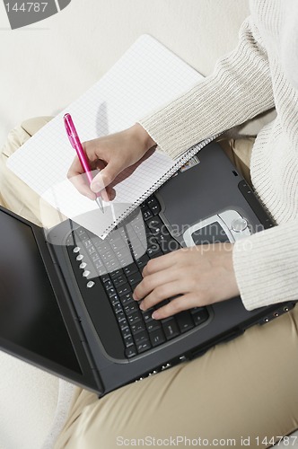 Image of Woman typing with laptop