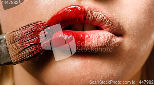 Image of Conceptual photo of a makeup and the lips of a girl