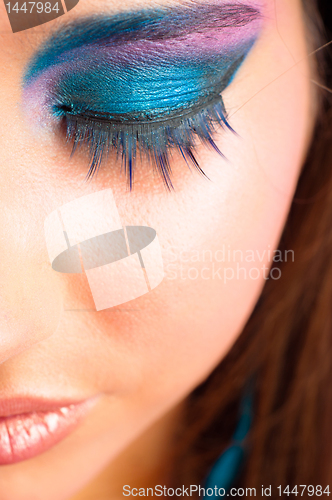 Image of closeup photo of a girl with beautiful makeup and selected focus