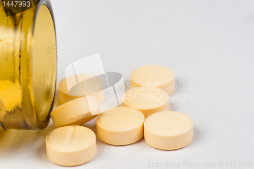 Image of Pills and bottle on white isolated background