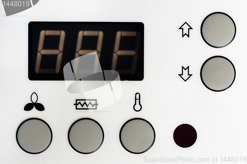 Image of Closeup of a thermostat with big buttons and display