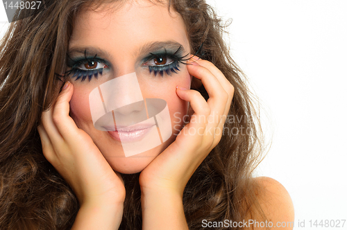 Image of young beautiful girl with extreme makeup on white isolated backg