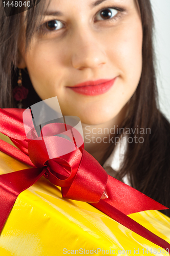 Image of Christmas present with a beautiful girl in the background