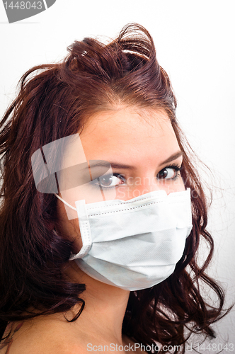 Image of Closeup of a girl in medical mask