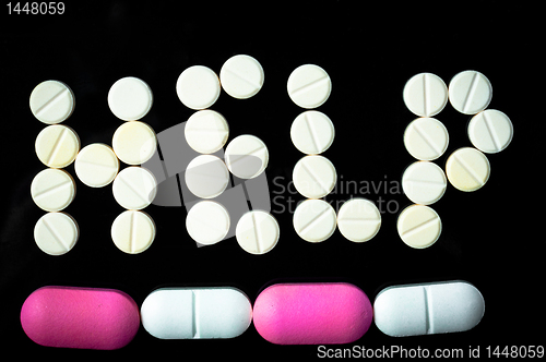 Image of Help sign made out of pills