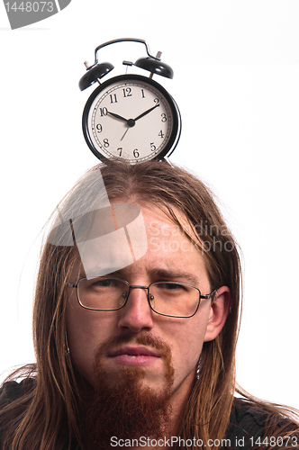 Image of Handsome man with clock on his head