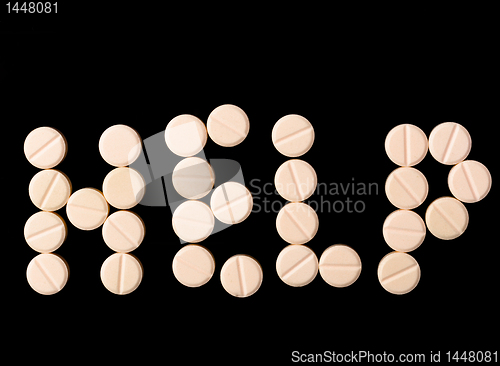 Image of Help sign made out of pills