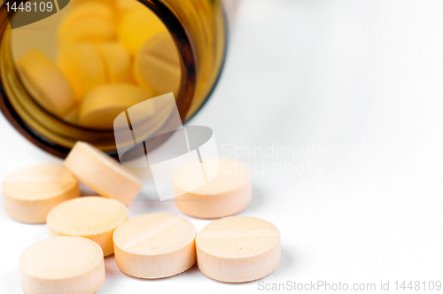 Image of Pills and bottle on white isolated background