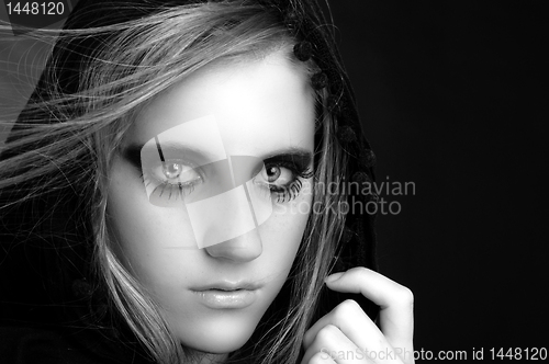 Image of Black and white photo of a hooded girl