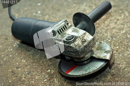 Image of A used circular saw on concrete floor