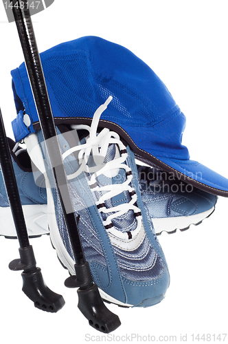 Image of sticks for Nordic walking and  sports shoes  isolated on white