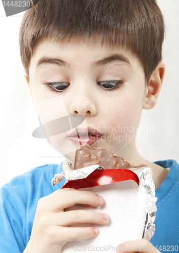 Image of Surprised boy with chocolate