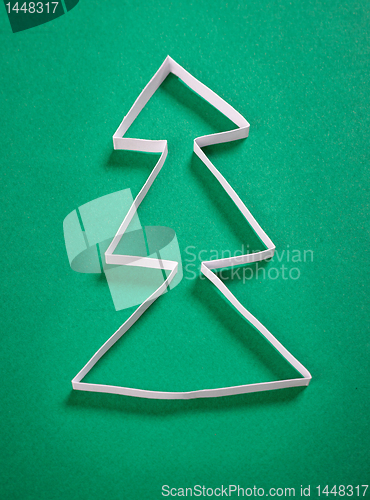 Image of paper christmas tree on green background
